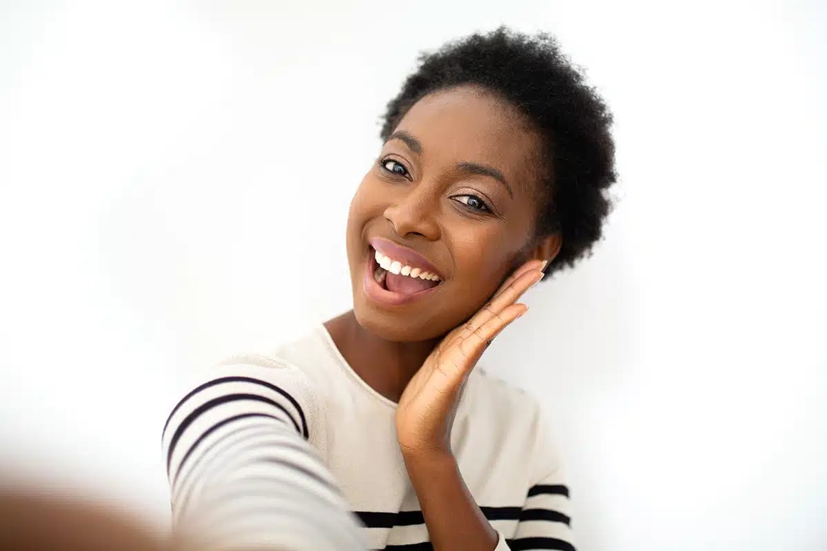 Happy young African American woman taking selfie Happy young African American woman taking selfie