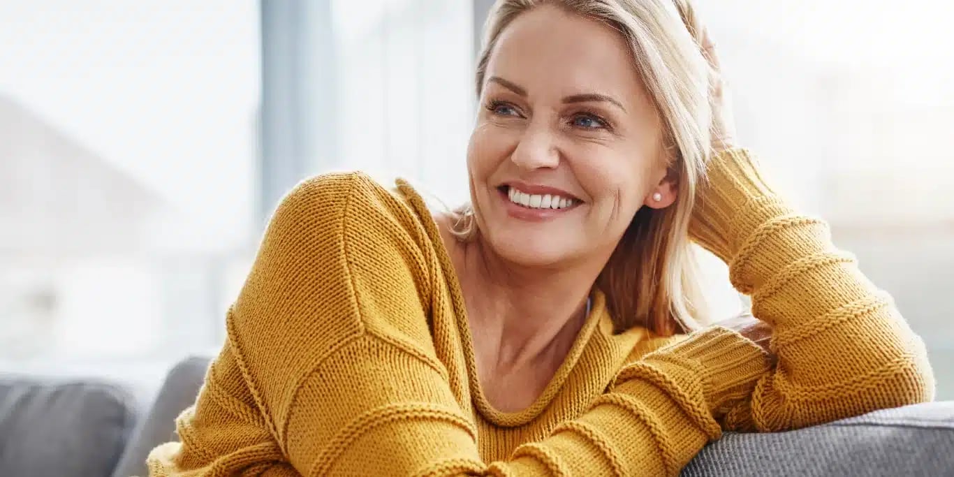 attractive mature woman relaxing on the sofa